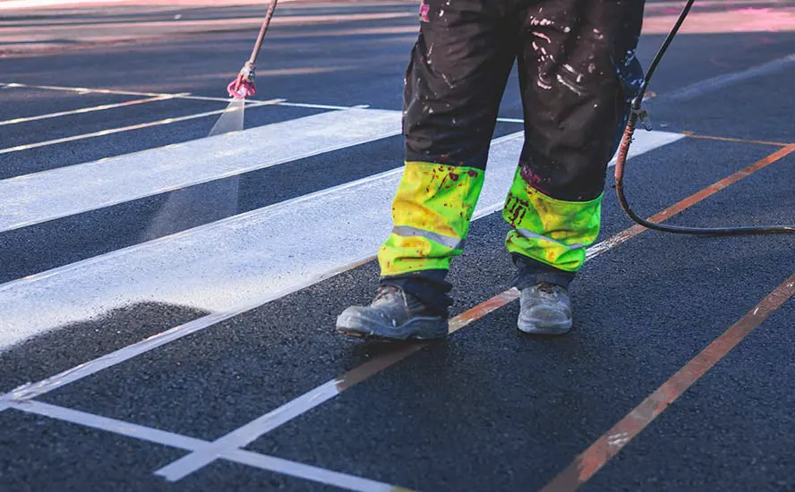 Manually marking lines on asphalt