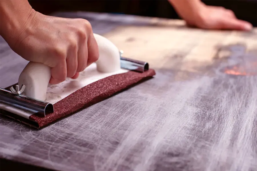 Physical sanding to remove varnish paint