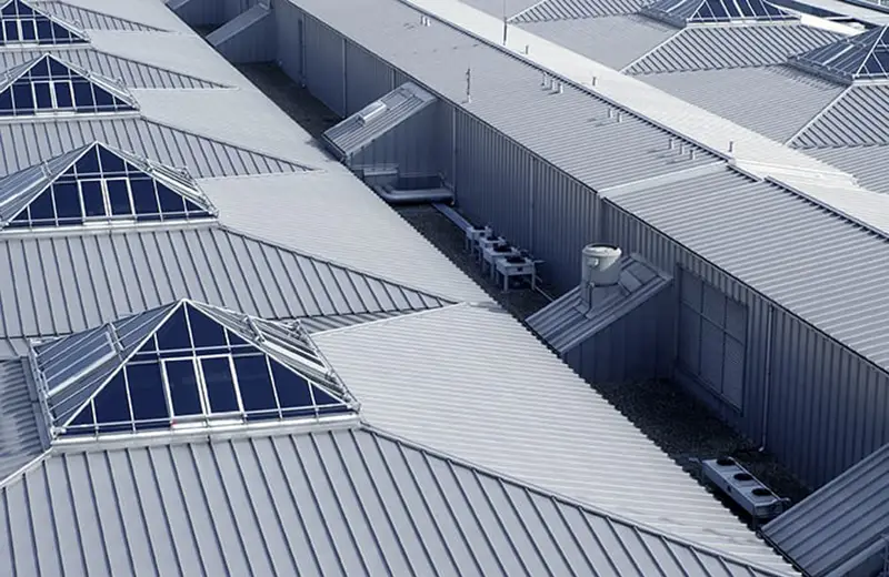 Roofs coated with fluoropolymer coatings